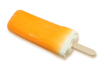 orange popsicle isolated on white background