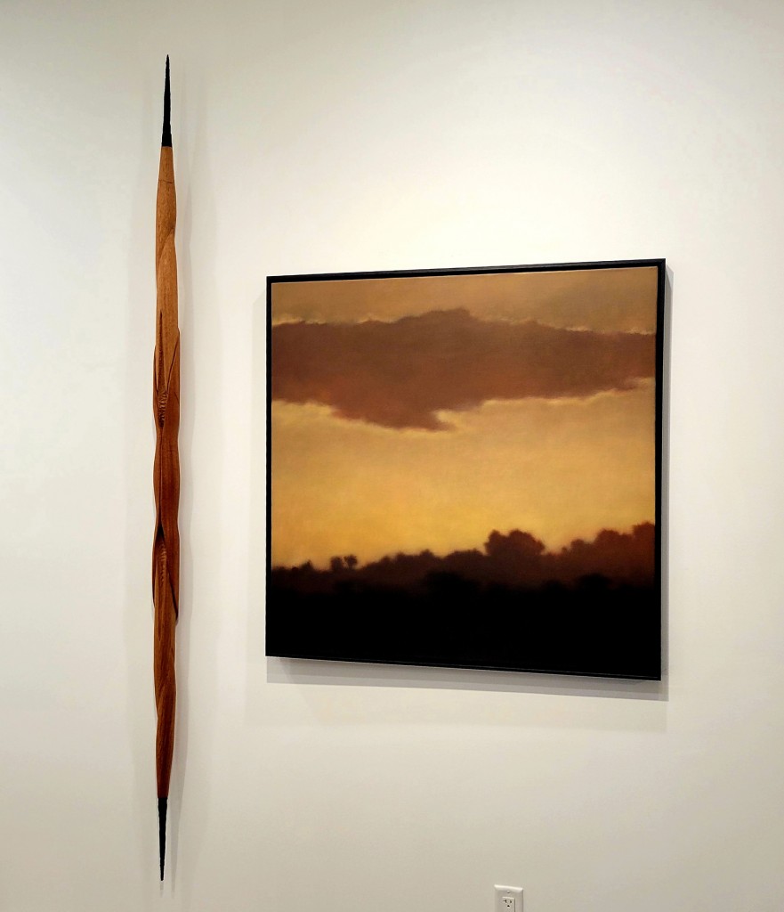 6. Patty Mooney, “Staff.” Mahogany and plaster, 90” x 4” x 5” Christie Scheele, “Sundrenched.” Oil on canvas, 40” x 40”